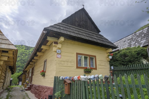 Colourfully painted wooden houses in the village of Vlkolinec, Unesco World Heritage Site,