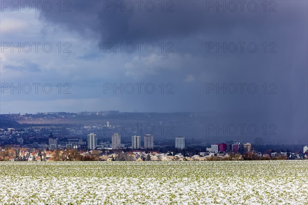 A snow shower moves through the Elbe valley towards the city centre of Dresden