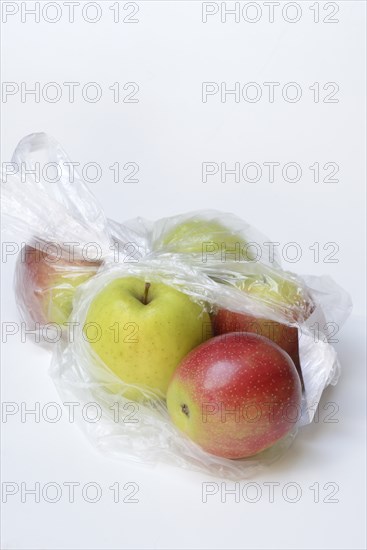 Apple in plastic bag, packaging