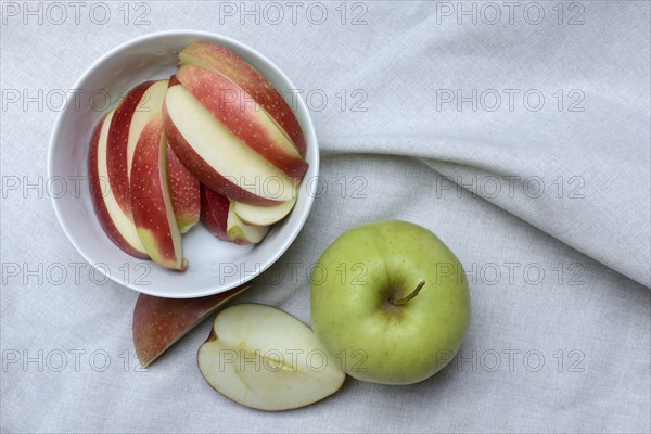 Apple and apple slices in peel, sliced apple