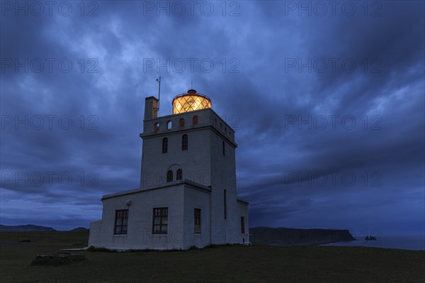 Lighthouse at the coast, twilight, cloudy mood, Dyrholaey, Iceland, Europe
