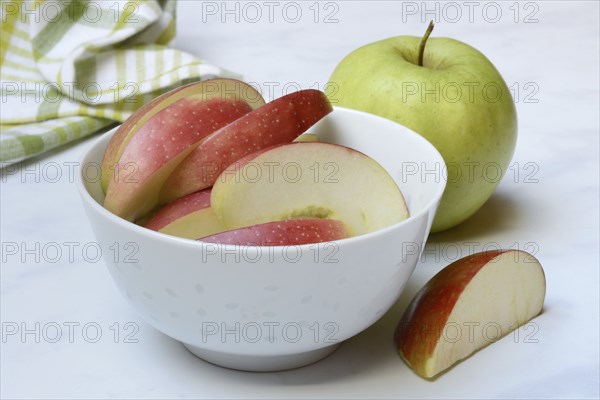 Apple and apple slices in peel, sliced apple