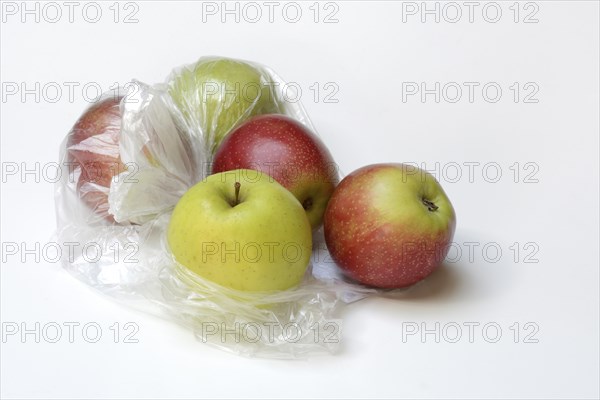 Apple in plastic bag, packaging