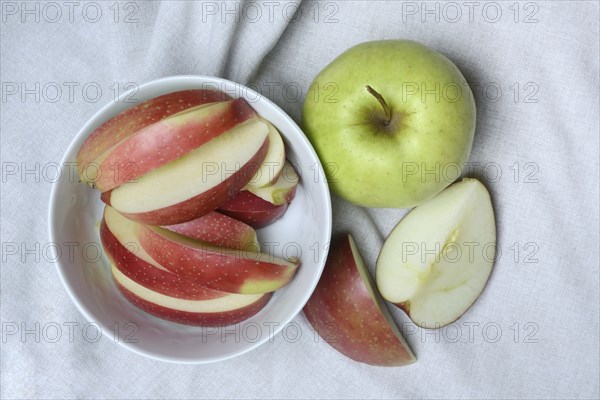 Apple and apple slices in peel, sliced apple