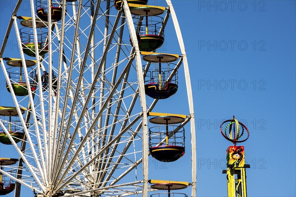 Bergen, Norway, May 2014: close-up and detail of colorful ferris wheel on blue sky, Europe