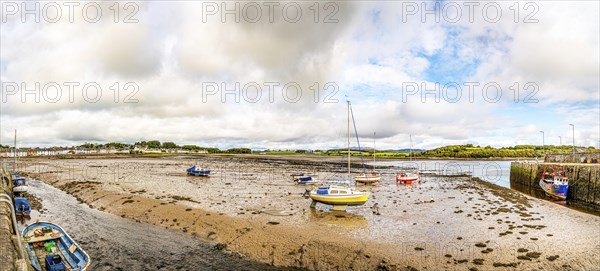 Panorama of the town and beached boats in the harbour at low tide, Garlieston, Dumfries & Galloway,