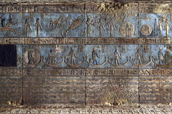 Hieroglyphic carvings and paintings on the interior walls of an ancient egyptian temple in Dendera