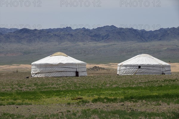Traditional yurts between montains in Mongolia