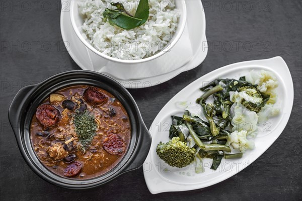 Chicken feijoada with chorizo portuguese rustic spicy traditional bean stew meal