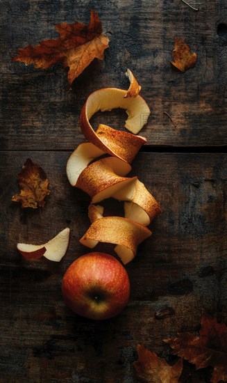 Apple peels on wooden table AI generated