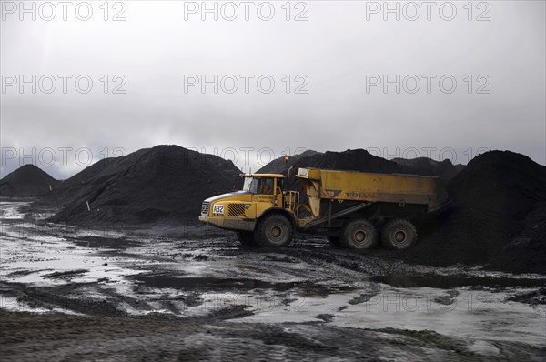 Westport, New Zealand, circa 2009: Coal truck dumps 70 ton load in stockpile at Stockton Coal Mine,