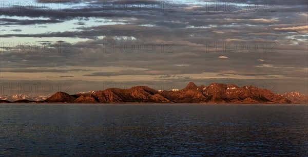 Panoramic view of the mountains on the Norwegian Sea coast at sunrise