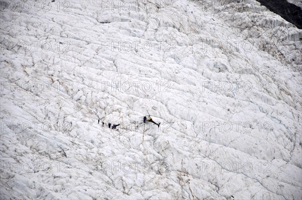 Group of tourists on the Franz Josef Glacier, Westland, New Zealand, Oceania