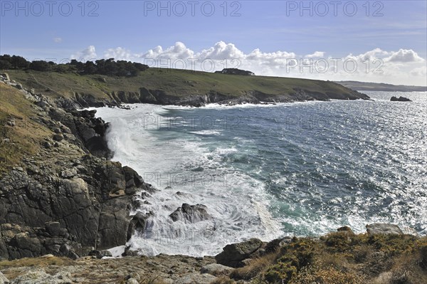 Waves crashing on the rocks of sea cliff at the Pointe du Millier at Beuzec-Cap-Sizun, Finistère,