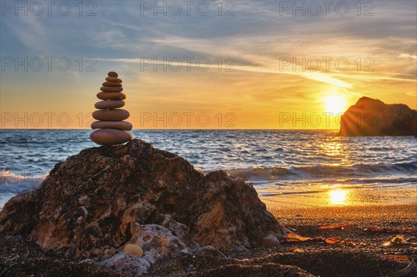 Concept of balance and harmony. Cairn stack of stones pebbles cairn on the beach coast of the sea