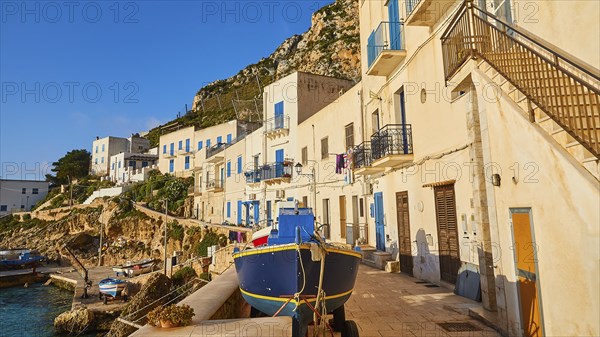 Morning light, row of houses, colourful houses, boat, Levanzo town, main town, Levanzo, Egadi