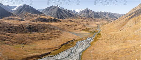 Aerial view, Burkhan mountain valley with meandering river, barren dramatic mountain landscape,