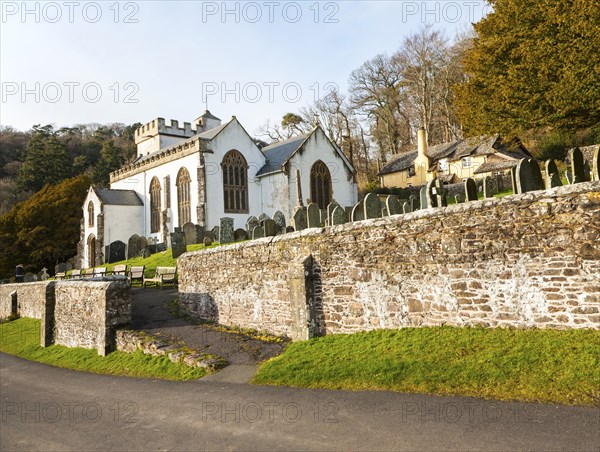 The Church of All Saints Selworthy, Somerset, England a whitewashed 15th-century building with a