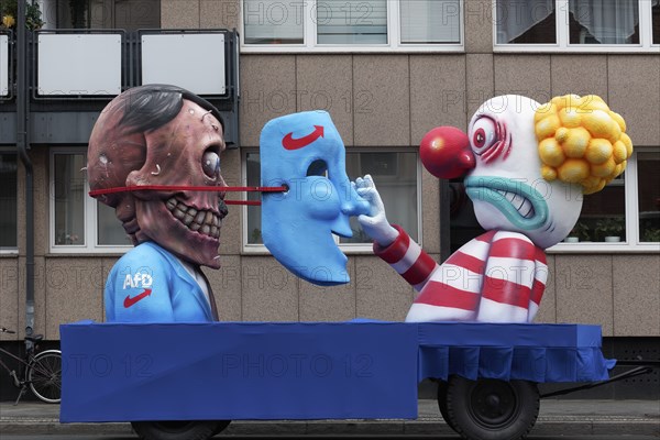 Behind the mask of the AFD is the skull of Hitler, papier-mâché figures, satirical float by Jacques