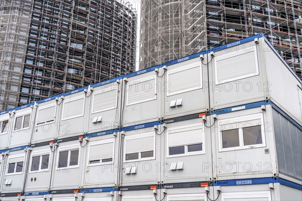 Large construction site, construction of a high-rise residential building, scaffolded shell,