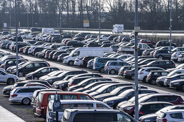 Large car park at the ferry terminal to the East Frisian islands of Norderney and Juist, Lower