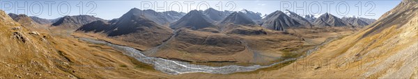 Aerial view, Burkhan mountain valley with meandering river, barren dramatic mountain landscape,
