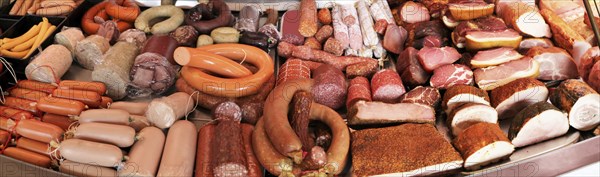 Panoramic picture of a sausage counter in a butcher's shop
