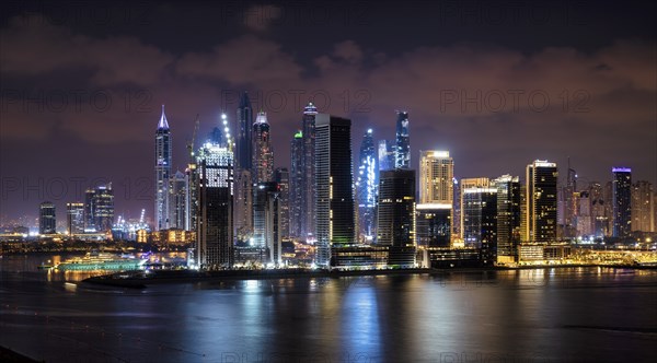 Night shot, skyline with Princess Tower, Elite Residence, luxury yacht OPERA owned by Sheikh