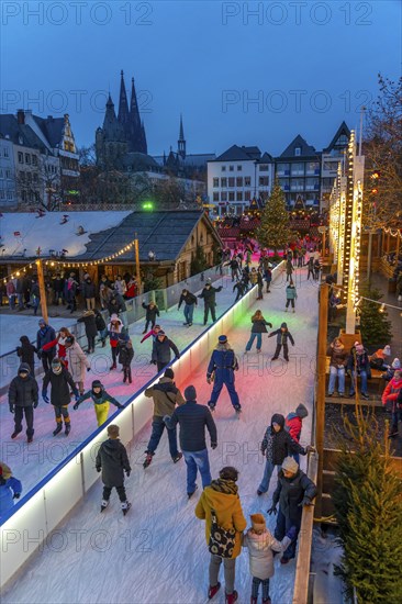 Ice rink at the Christmas market on the Heumarkt in the old town of Cologne, Cologne Cathedral,