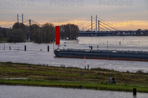 High water on the Rhine near Duisburg, freighter enters the harbour canal, Neuenkamp Rhine bridge,