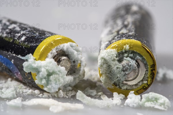Leaked batteries, AA batteries, oxidised, leaked potassium carbonate and ammonium chloride