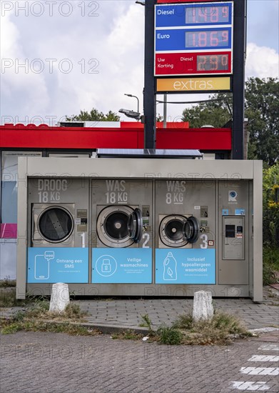 Self-service washing machines, for laundry, clothing, open 24 hours, around the clock, at a petrol
