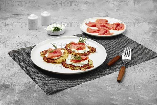 Crispy potato fritters with salmon and soft cheese