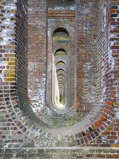 Pattern of brick arches in the railway viaduct opened in 1849, Chappel, Essex, England, United
