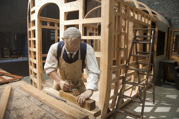 Mannequin of a carpenter in the carriage making section of Steam museum of the Great Western