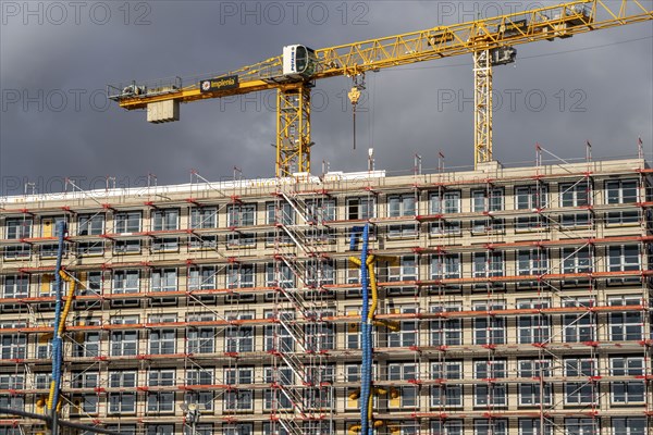 Large construction site, scaffolded shell of an office building complex, O-Werk Campus in Bochum,