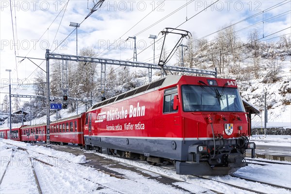 Rhaetian Railway train on the Albula railway Passenger train at Filisur station, Switzerland,