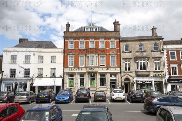 Lloyds Bank Limited building and shops in the Market Place, Devizes, Wiltshire, England, United