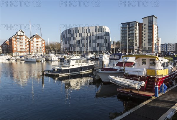 University of Suffolk waterfront buildings boats moored in marina, Ipswich Wet Dock waterside