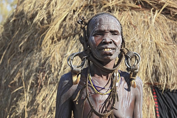 South Ethiopia, in the Maco National Park, Mursi tribe, older Mursi woman with naked upper body and