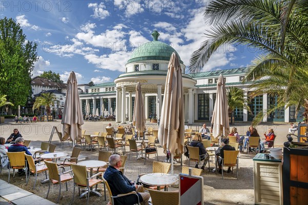 Street café on the Brunnenhof with spring temple and Wandelhalle, spa town of Bad Pyrmont, Lower