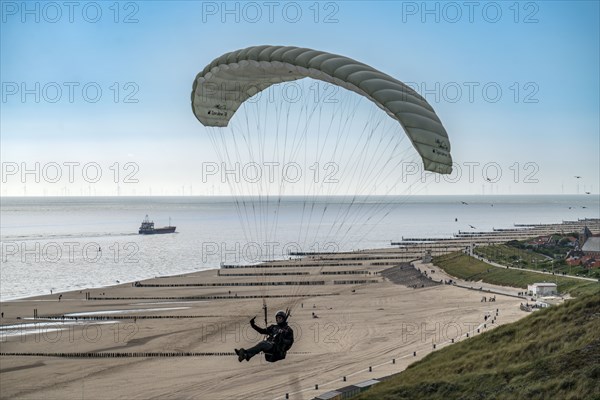Paragliders along the dunes of Zoutelande, in Zeeland, South Holland, Netherlands