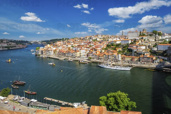 Aerial view of Porto city and Vila Nova de Gaia and Douro river with moored sailling ship from Dom