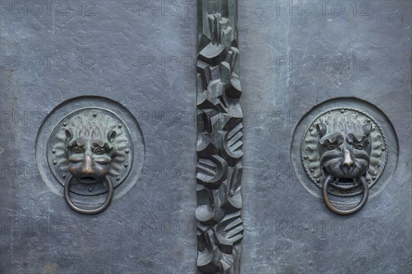 Lion heads as door knockers at the main entrance of St Lorenz, Nuremberg, Middle Franconia,