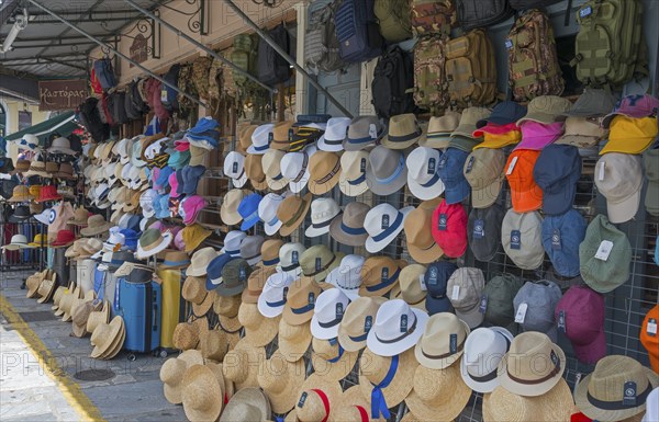 Market stall with a large selection of hats of different colours and shapes, Kalamata, Messinia,