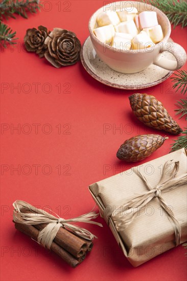 Christmas or New Year composition. Decorations, box, cinnamon, cones, fir and spruce branches, cup