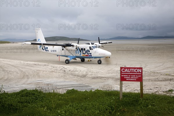 Flybe plane on sandy airstrip Isle of Barra airport, Barra, Outer Hebrides, Scotland, UK