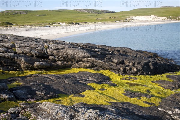 Rocky headland and sandy beach at Bagh a Deas, South Bay, Vatersay island, Barra, Outer Hebrides,