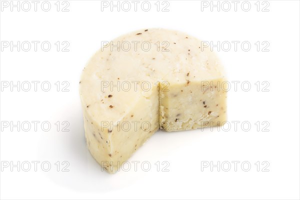 Piece of cheddar cheese isolated on white background. Side view, close up