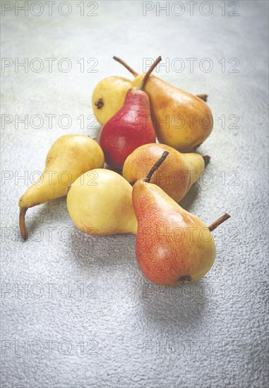 Small pears, Duchess variety, scattered on the table, top view, no people